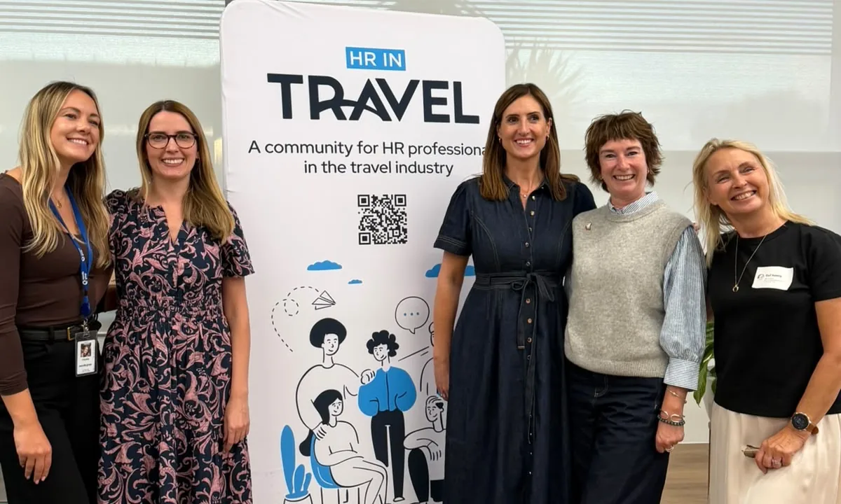 By the HR in Travel banner at their community event